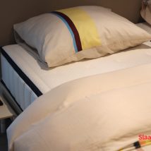 kleurrijk-bed-opgemaakt-uniek
